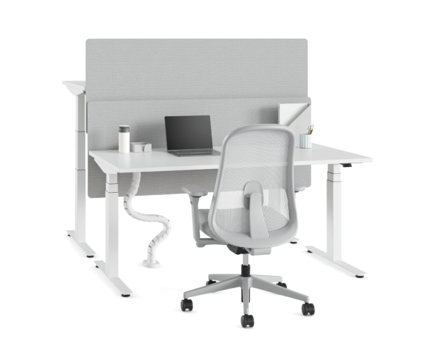 Nevi sit-to-stand desk with chair and laptop