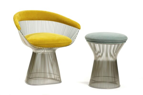 Platner stool with a yellow arm chair