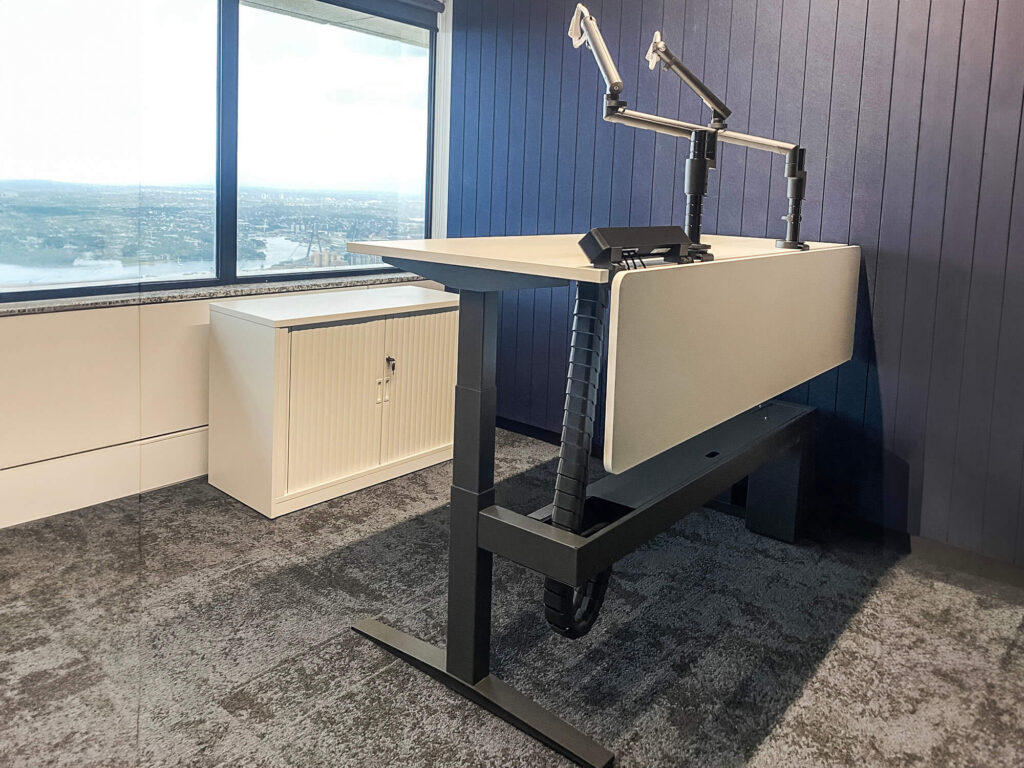 Royal Bank of Canada office sit to stand workstation with monitor arms