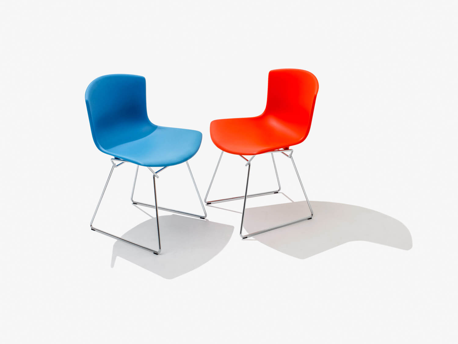 Bertoia Molded Shell Stacking Side Chair side red and blue