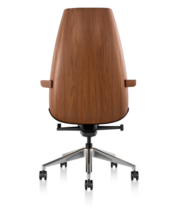 The back side of a Clamshell Office Chair featuwing a wooden back shell in a white room