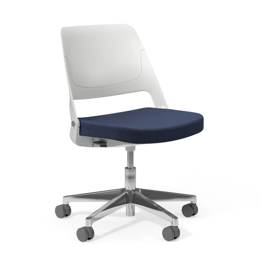 an armless white Ollo Side Chair with a dark blue seat with castor wheels in a white room