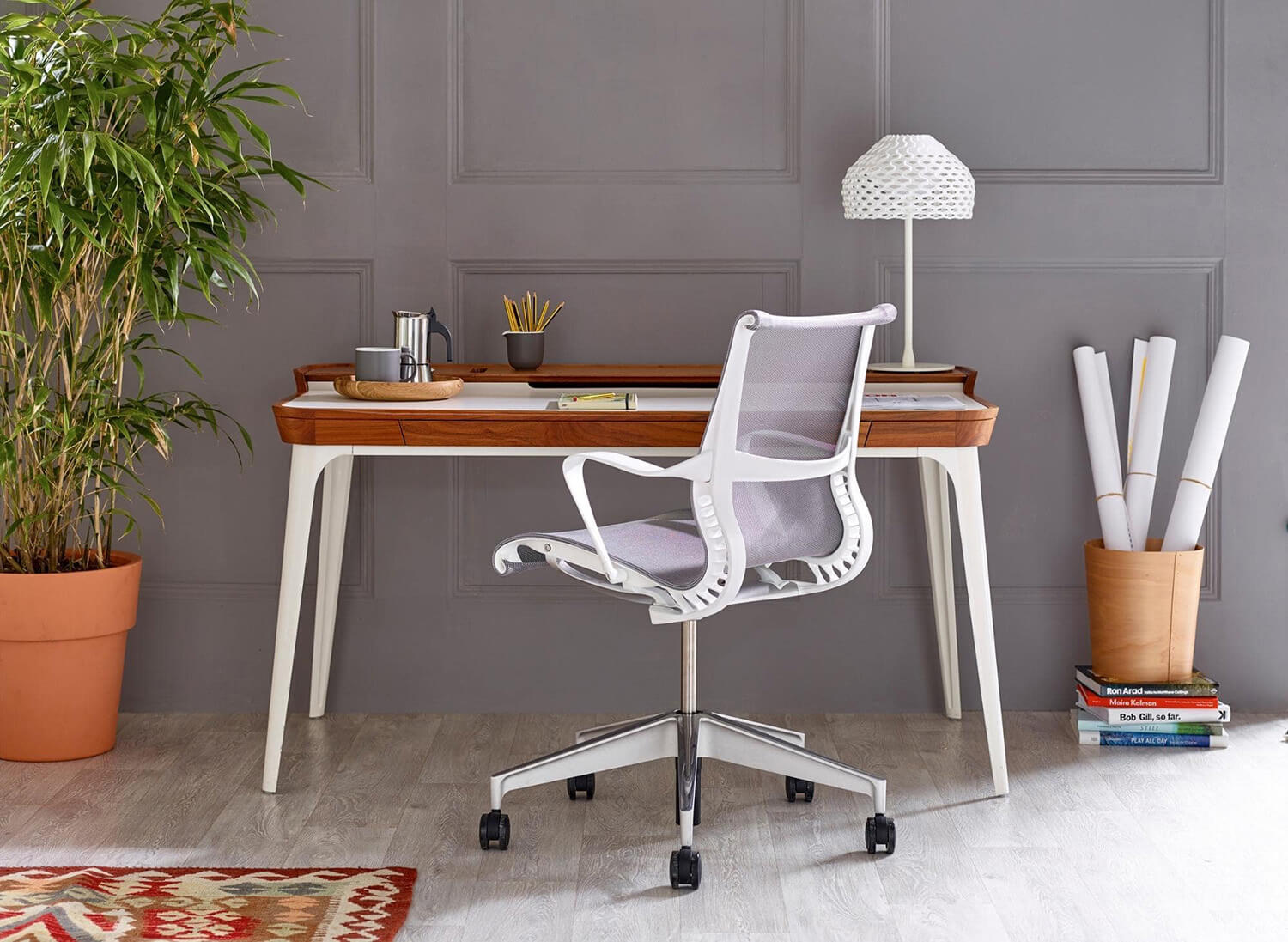 a white office chaiand a wooden top desk