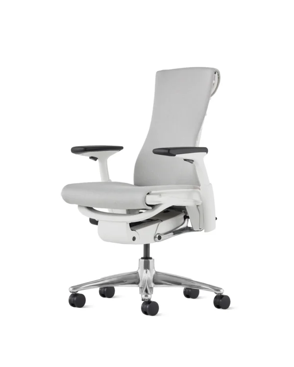 the front side angle of an embody chair by herman miller in gray colour upholstery and white frame in a white room